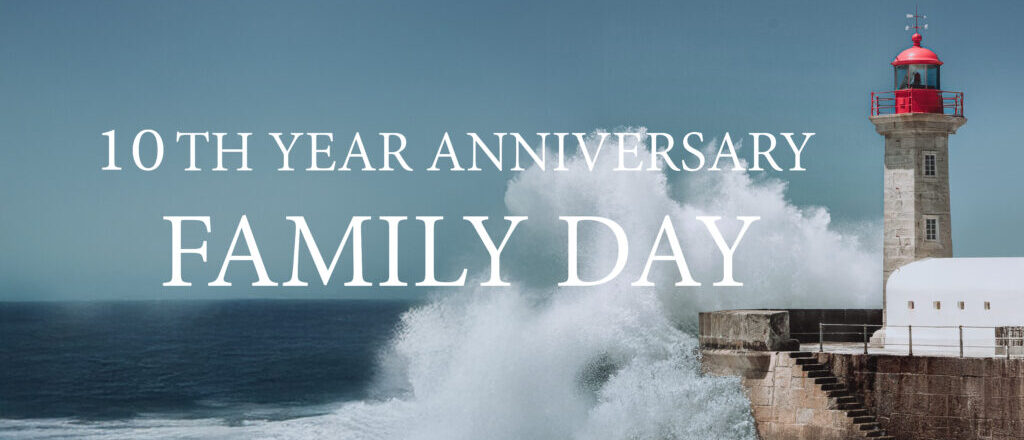 Lighthouse with waves and anniversary text.