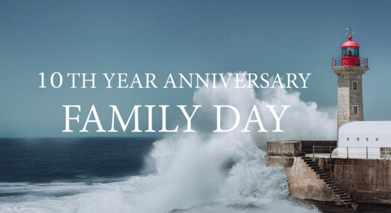 Lighthouse with waves and anniversary text.